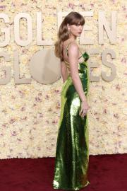 Taylor Swift Stuns as She Walks 2024 Golden Globes Red Carpet Solo