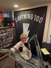 Cam Country Performs Haunting Lullaby on Stage While Hugging Child